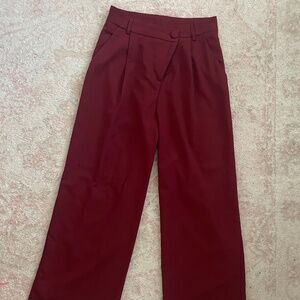 Asymmetrical wide legged pleated trousers
